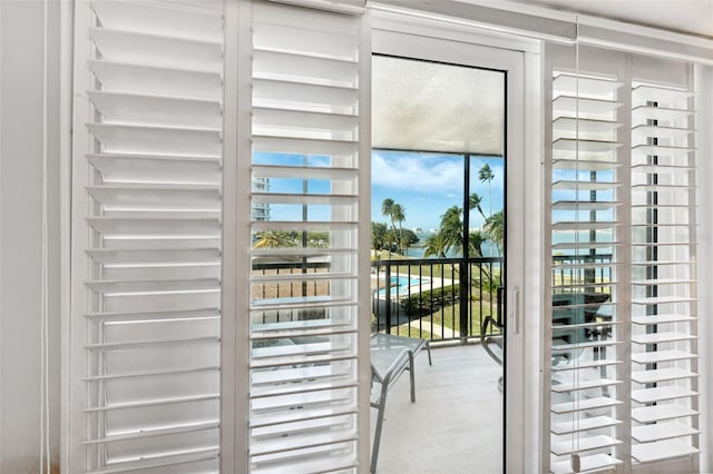 doorway to outside with concrete floors