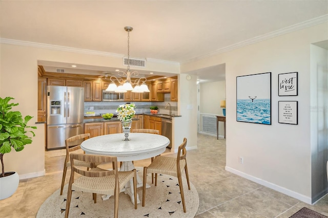 100 Oakmont Ln Unit 301, Belleair, FL 33756 - dining room featuring ornamental molding, a chandelier, baseboards, and light tile patterned flooring