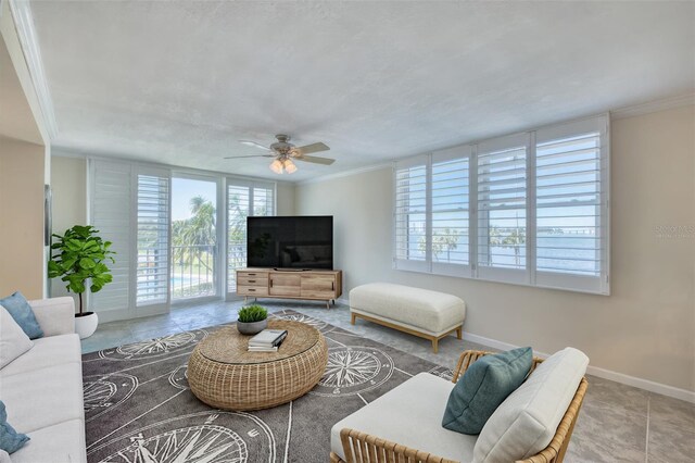 100 Oakmont Ln Unit 301, Belleair, FL 33756 - living area with ceiling fan, baseboards, crown molding, and tile patterned floors