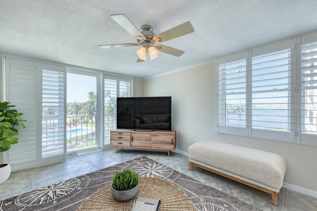 100 Oakmont Ln Unit 301, Belleair, FL 33756 - tiled bedroom with access to outside, baseboards, a ceiling fan, and crown molding