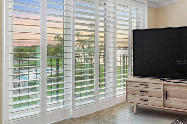 100 Oakmont Ln Unit 301, Belleair, FL 33756 - doorway to outside with crown molding and tile patterned flooring