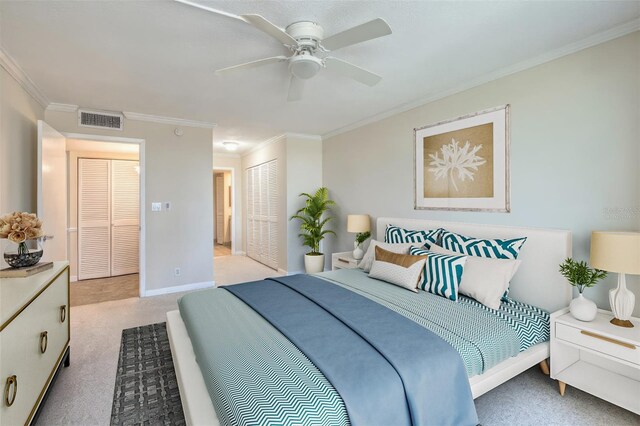 100 Oakmont Ln Unit 301, Belleair, FL 33756 - carpeted bedroom featuring crown molding, a closet, baseboards, and a ceiling fan
