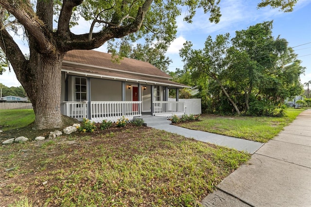 view of front of house with a front lawn and covered porch