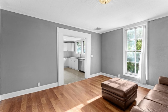 tiled living room featuring sink