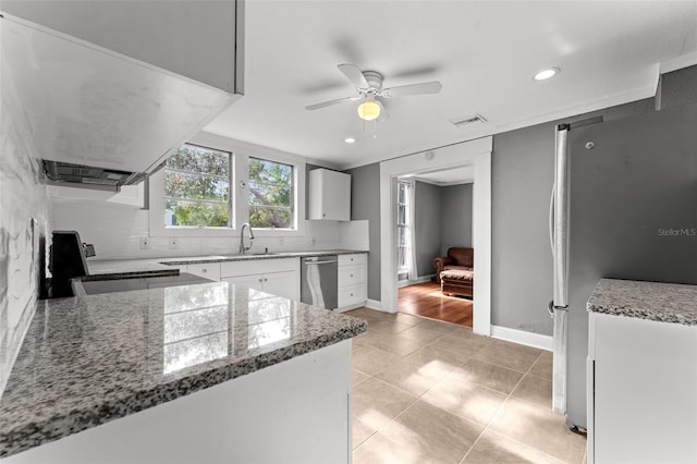 kitchen featuring stainless steel appliances, stone countertops, ceiling fan, white cabinetry, and light hardwood / wood-style flooring