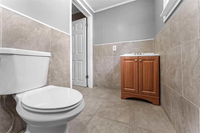 bathroom featuring tile walls, toilet, and tile patterned floors