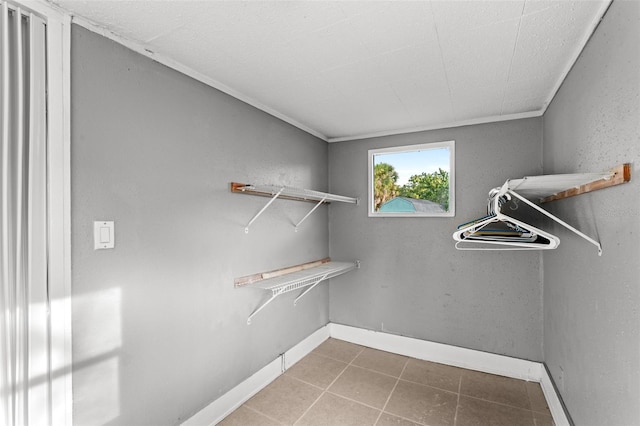 walk in closet featuring tile patterned flooring