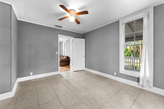 interior space with ceiling fan