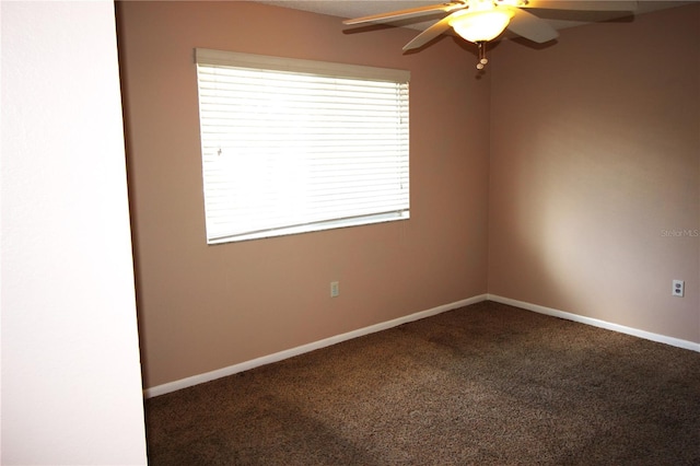 spare room featuring carpet flooring and ceiling fan