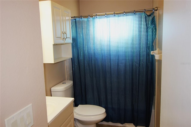 bathroom featuring toilet and vanity