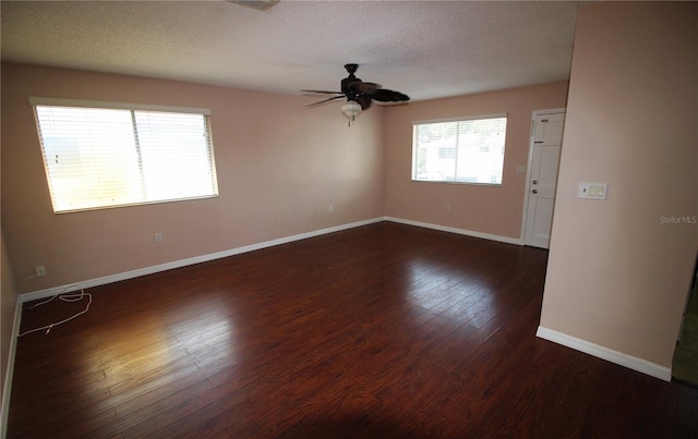 empty room with hardwood / wood-style flooring, a textured ceiling, and ceiling fan