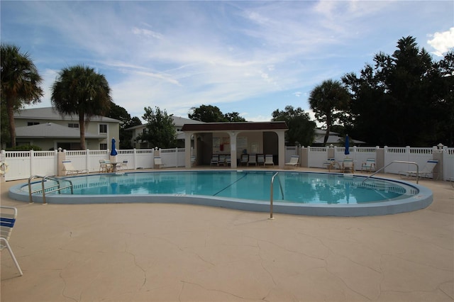 view of pool featuring a patio