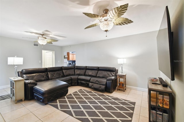 living room with light tile patterned floors and ceiling fan