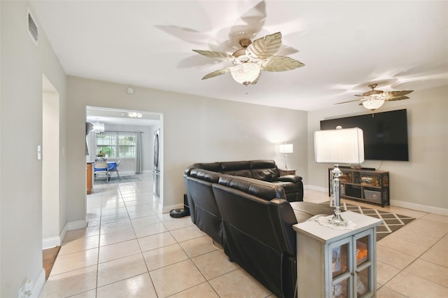 tiled living room featuring ceiling fan