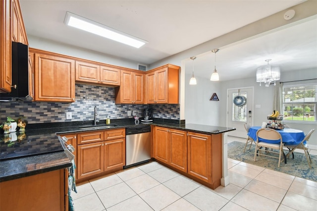 kitchen with light tile patterned flooring, dishwasher, sink, hanging light fixtures, and kitchen peninsula