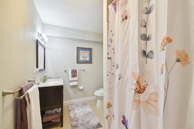 bathroom with tile patterned floors, toilet, a shower with shower curtain, and vanity