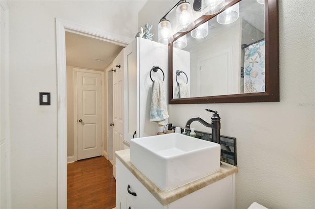 bathroom featuring vanity and hardwood / wood-style floors