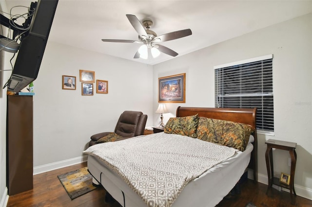 bedroom with ceiling fan and dark hardwood / wood-style flooring