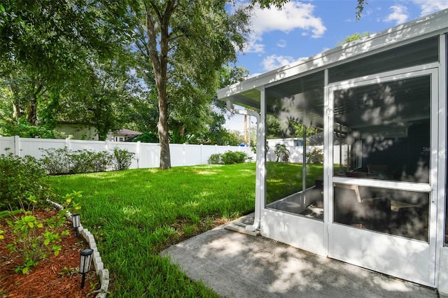 view of yard featuring a sunroom