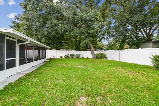 view of yard with a sunroom