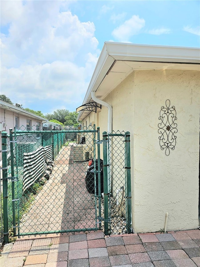 view of gate featuring fence