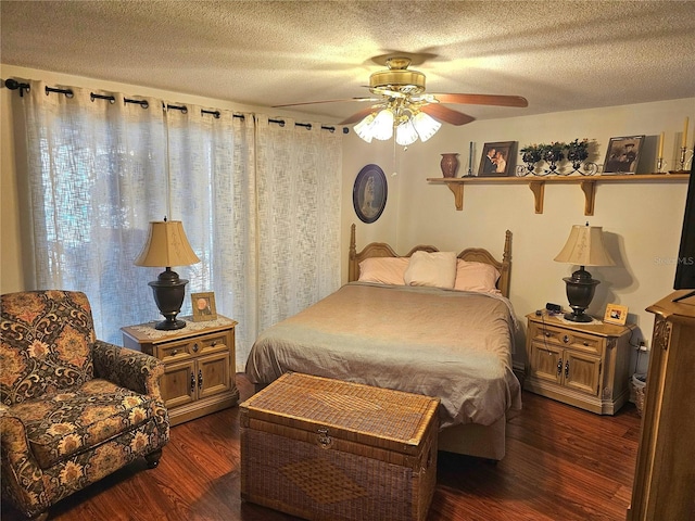 bedroom with dark wood-type flooring, a textured ceiling, and a ceiling fan