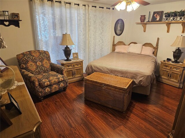 bedroom with dark wood finished floors and ceiling fan