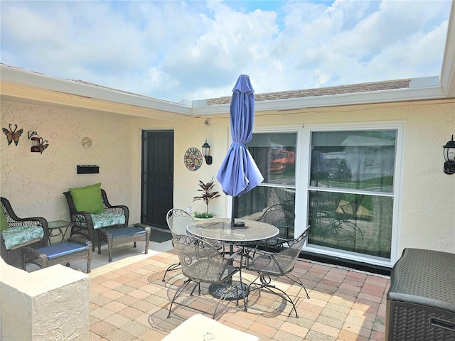 view of patio featuring outdoor dining space