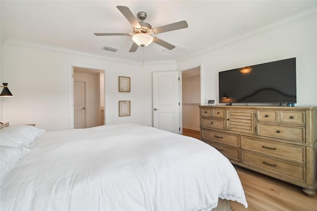 bedroom featuring crown molding, ceiling fan, and light hardwood / wood-style floors