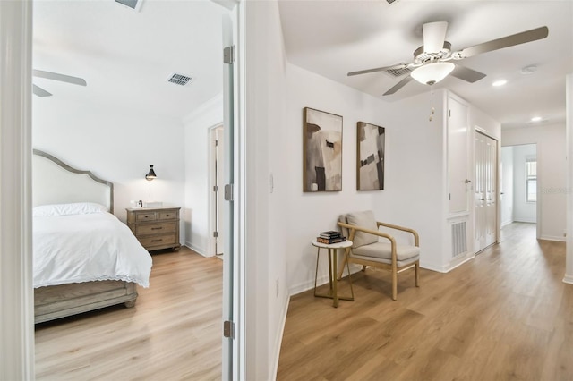 bedroom featuring ceiling fan and light hardwood / wood-style flooring