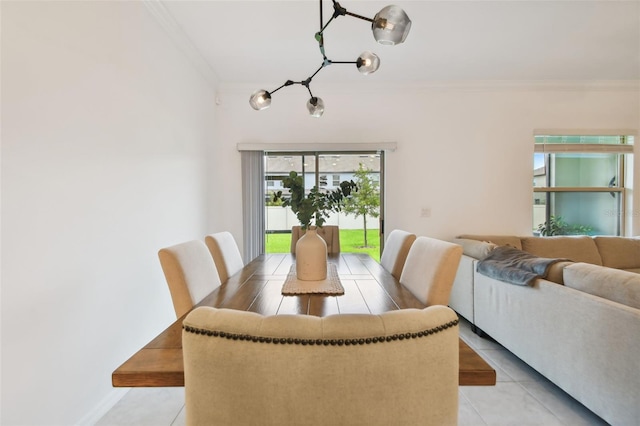 dining area featuring light tile patterned flooring and ornamental molding