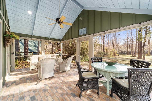 sunroom / solarium featuring vaulted ceiling, wood ceiling, and ceiling fan