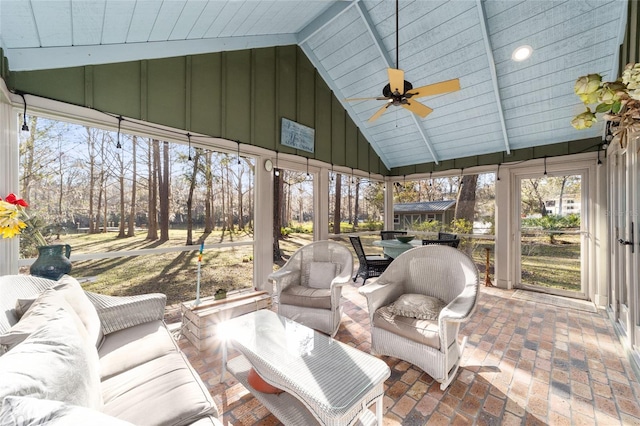 sunroom / solarium featuring vaulted ceiling and ceiling fan