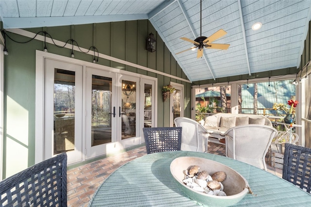 wooden terrace featuring ceiling fan, french doors, and a patio area