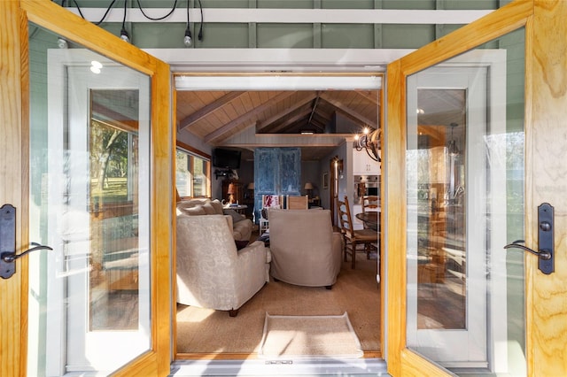 interior space featuring vaulted ceiling with beams, hardwood / wood-style flooring, and wooden ceiling