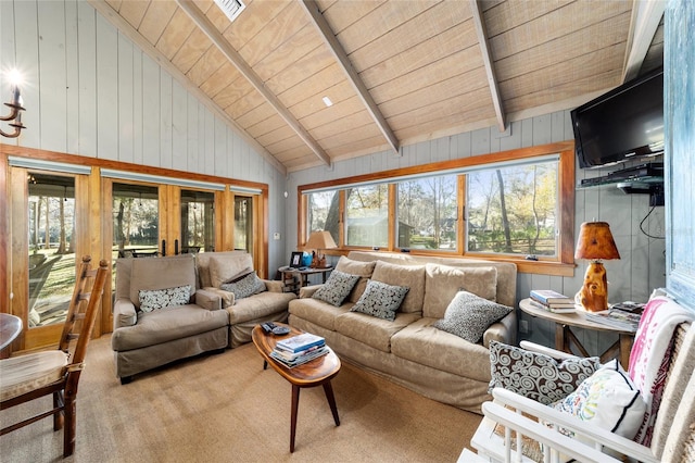 carpeted living room featuring high vaulted ceiling, french doors, beamed ceiling, and wooden ceiling