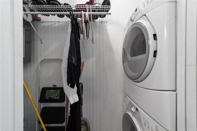 washroom featuring stacked washer and dryer