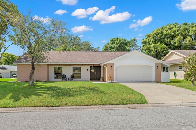 ranch-style house with a front yard and a garage