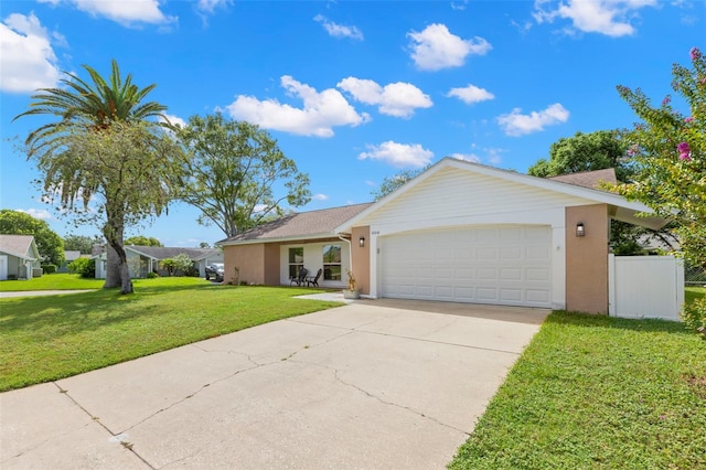 ranch-style home with a garage and a front yard