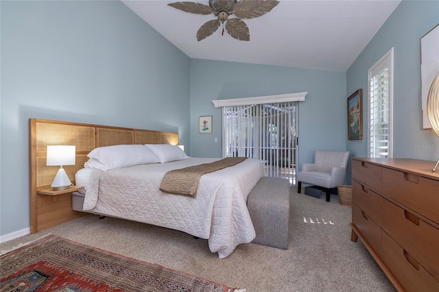 bedroom with lofted ceiling, ceiling fan, multiple windows, and light carpet