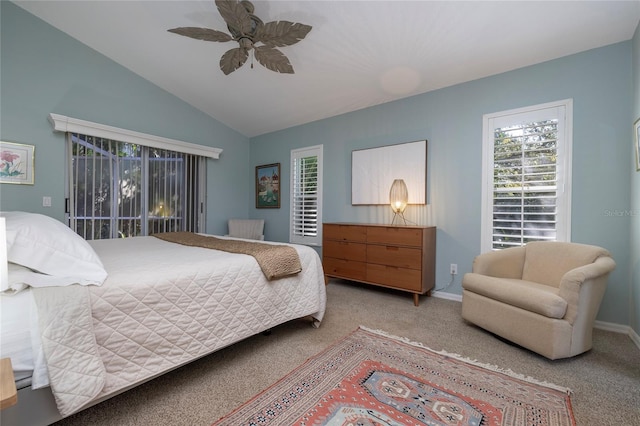 carpeted bedroom with ceiling fan and vaulted ceiling