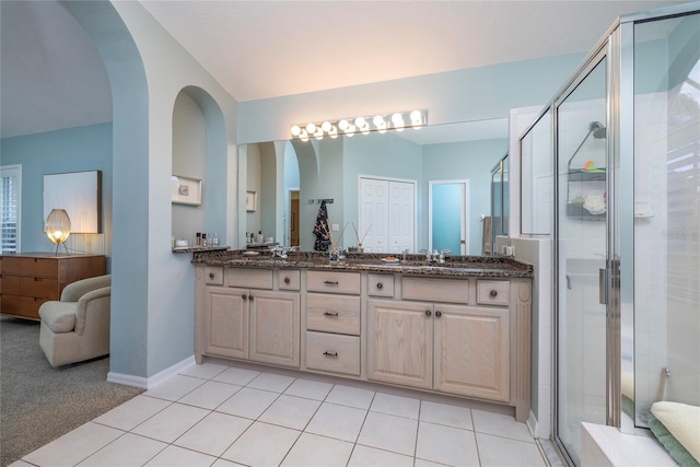 bathroom with vanity, tile patterned floors, and walk in shower