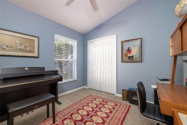 carpeted home office with lofted ceiling and ceiling fan