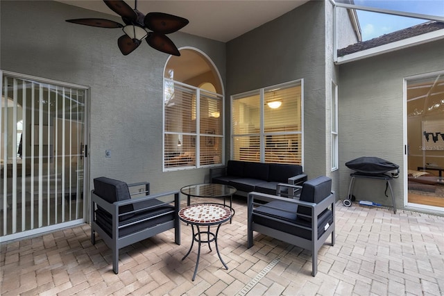 view of patio / terrace featuring area for grilling, an outdoor living space, and ceiling fan