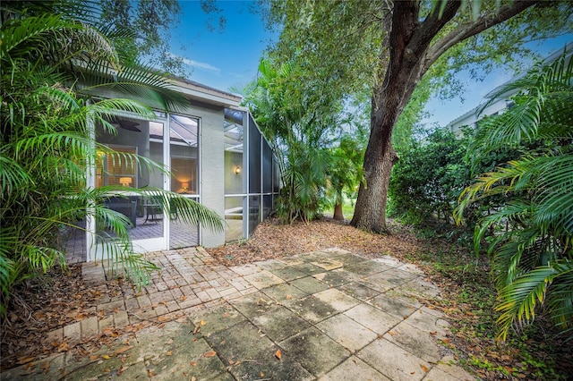 view of patio / terrace with a lanai