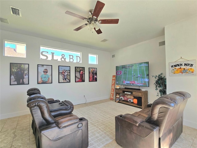 living room with ceiling fan and light tile patterned floors