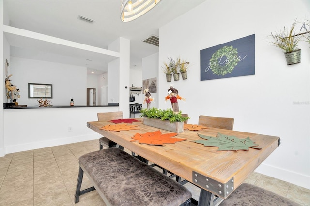 dining room with light tile patterned flooring