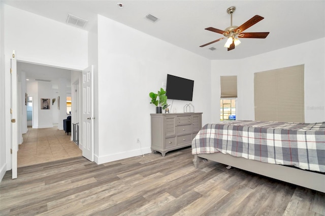 bedroom featuring ceiling fan and light hardwood / wood-style flooring