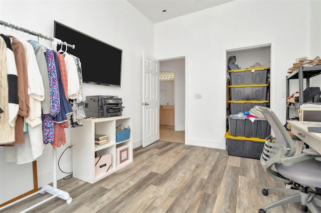 home office with wood-type flooring