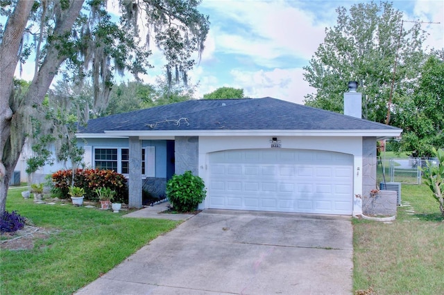 single story home with a front yard and a garage